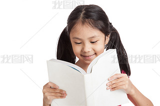 Happy little asian girl  read a book