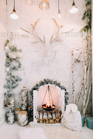 Interior in a classic style decorated for Christmas. Artificial fireplace. Stylish Christmas minimal