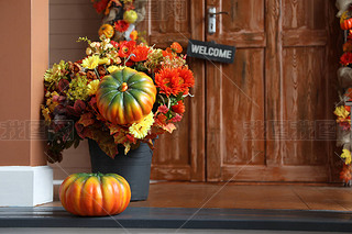 Festive composition near house entrance decorated for traditional autumn holidays