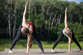 Yoga class: trikonasana pose