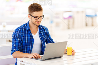 Positive freelancer working on the  laptop