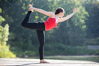 Teenage girl in Natarajasana pose