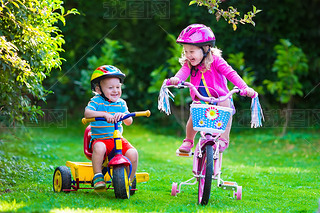 Two children riding bikes