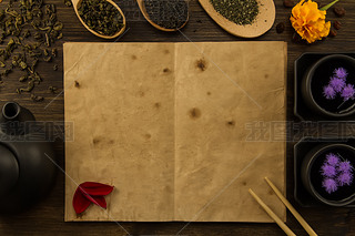 black, Oolong in a spoon, dried apples on the old blank open book on wooden background. Menu, recipe