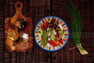 There are vegetables laid out neatly on a bright plate