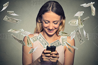 Happy woman using artphone with dollar bills flying away from screen