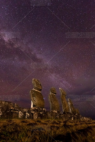 Moais in Ahu Vai Uri, Tahai Archaeological Complex, Rapa Nui National Park, Easter Island in the nig