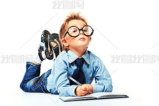 boy in spectacles and suit lying on a floor