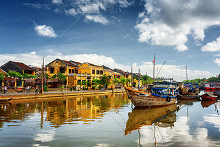 Wooden boats on the Thu Bon River in Hoi An, Vietnam
