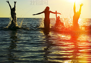 people jumping in ocean