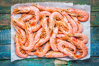 fresh raw prawns on paper 