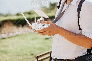 A man controls a drone
